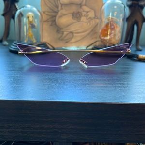 Poppy Lissiman - demon sunglasses in lilac